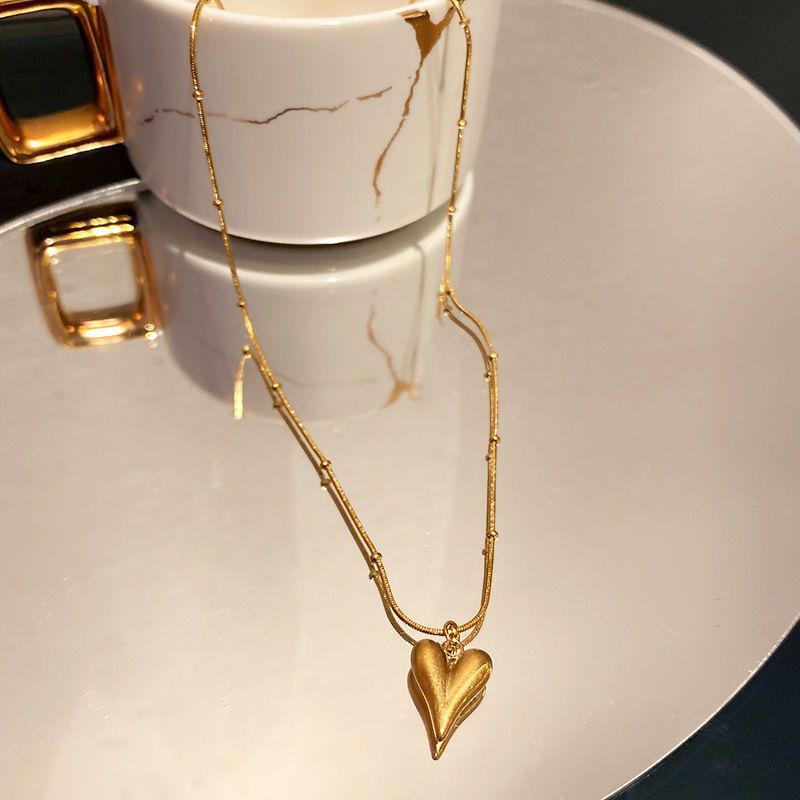 b202cf73-470d-453b-8498-21f5357d851f.jpeg.a Beaded Snake Chain Heart Pendant Necklace for Women - Image 1