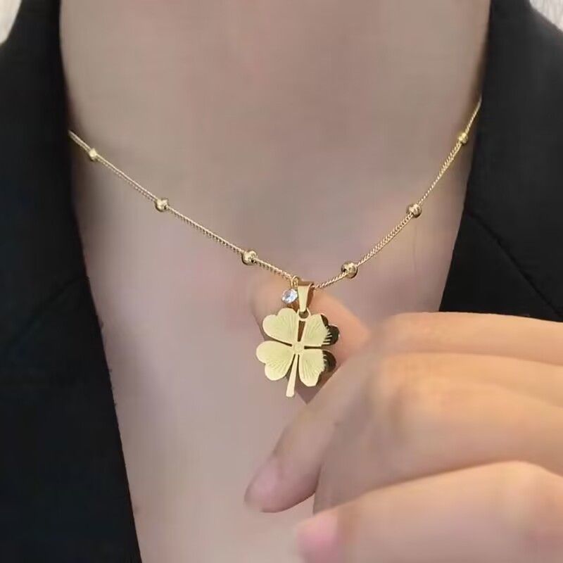 13389789523978886 Lucky Four-Leaf Clover Necklace – Hollow Titanium Steel with Crystals - Image 1